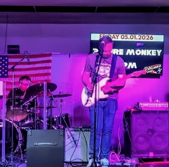 3 Wire Monkey singer and drummer at a live show